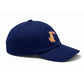 Introducing the Bits & Bows Patriotic Dog Baseball Hat—a navy blue dog hat adorned with an embroidered tan dog holding a small American flag in its mouth on the front panel.