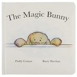 The Magic Bunny Book by Jellycat is a charming white children’s book featuring an illustrated bunny peeking over a surface—perfect for bedtime stories.