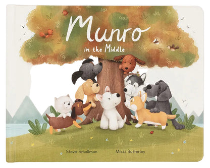 The Jellycat Munro in the Middle Book features an illustrated cover with cartoon pups around a tree, hills, and sky. Authors: Steve Smallman and Mikki Butterley.