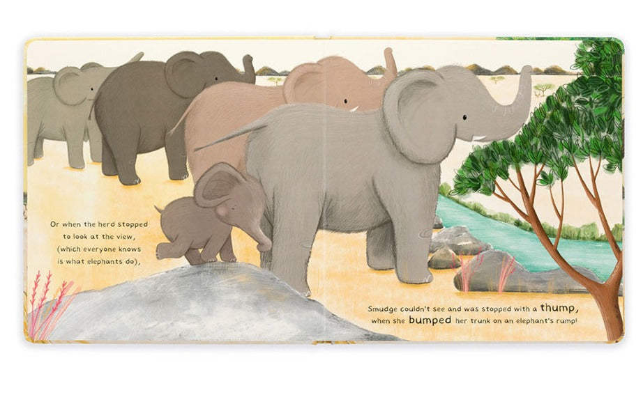 Illustrated scene of a herd of elephants with a baby elephant named Smudge bumping her trunk on an adult elephant's rump near a river. Text describes the Littlest Elephant and the herd looking at the view, perfect for young readers to enjoy in this delightful rhyming story. Product Name: Jellycat Smudge The Littlest Elephant Book Brand Name: Jellycat