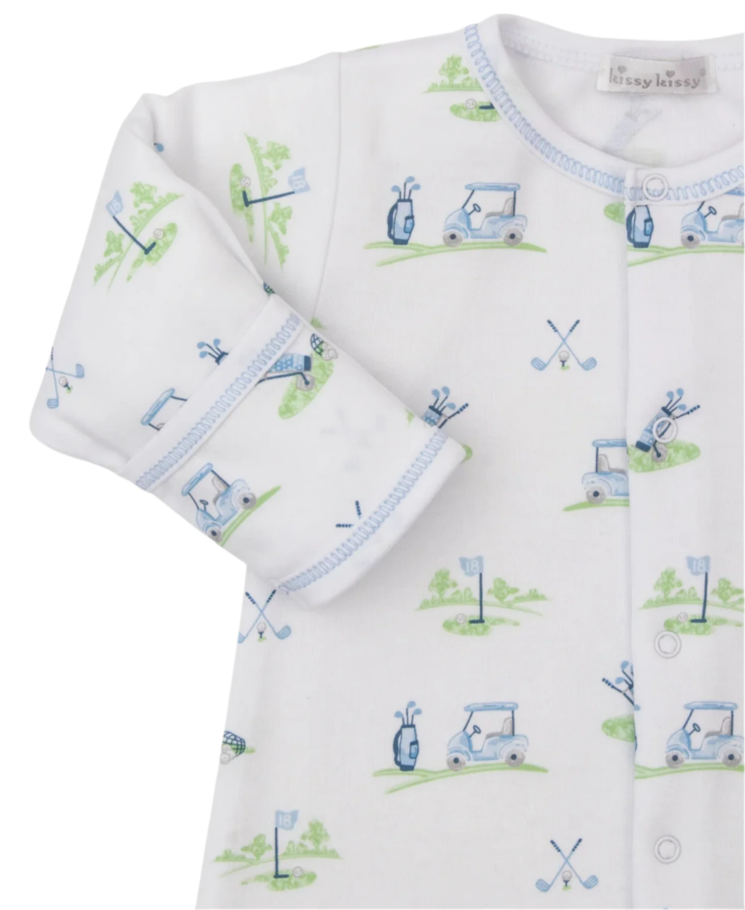 A close-up of the Kissy Kissy Fairway Foursome Printed Convertible Gown, a white Pima cotton baby onesie featuring golf-themed illustrations such as golf carts, clubs, and flags.