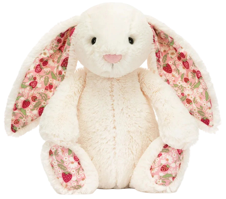 Plush white bunny with pink floral-patterned inner ears and feet, sitting upright and facing forward—this charming Blossom Cream Bunny ‘Berry’ by Jellycat closely resembles a classic cream Berry Bunny.