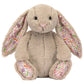 Blossom Beige Bunny 'Petal' by Jellycat is a plush with long floppy ears and wildflower prints on the inner ears and feet, inspired by the Garden Club collection.