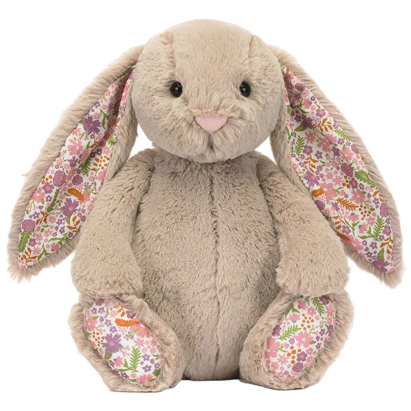Blossom Beige Bunny 'Petal' by Jellycat is a plush with long floppy ears and wildflower prints on the inner ears and feet, inspired by the Garden Club collection.