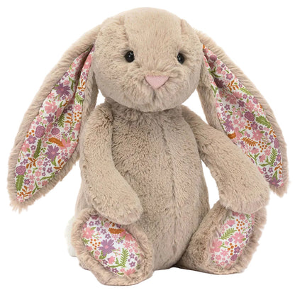 Blossom Beige Bunny 'Petal' by Jellycat is a plush bunny with long floppy ears and wildflower-patterned inner ears and feet—an adorable addition to any Garden Club collection.