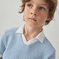 A young boy with light brown hair and blue eyes wears the Gingersnaps Boys' Husker Striped Terry Shirt, featuring blue and white stripes, as he looks slightly upward against a plain background.