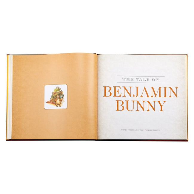 Experience "The Classic Tale Of Peter Rabbit, Leather Edition" by Graphic Image, showcasing a beautifully depicted rabbit on the left page and the title on the right. Immerse yourself in these adventure-filled stories with original illustrations that bring cherished characters to life.