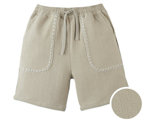 Gingersnaps Boys' Marlow Textured Drawstring Shorts in beige cotton-linen feature two front pockets with white zigzag stitching, shown close-up to highlight the unique fabric texture.