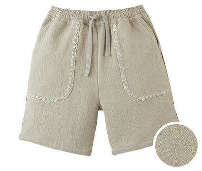 Gingersnaps Boys' Marlow Textured Drawstring Shorts in beige cotton-linen feature two front pockets with white zigzag stitching, shown close-up to highlight the unique fabric texture.