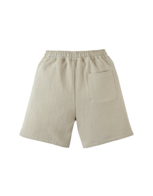 Gingersnaps Boys' Marlow Textured Drawstring Shorts in beige feature an elastic waistband, contrast stitching, and a single back pocket; shown on a white background.