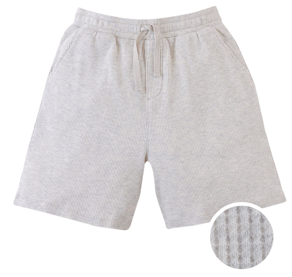 Gingersnaps Boys' Denzel Waffle Knit Drawstring Shorts feature a light gray melange color, textured waffle knit finish, elastic waistband, and side pockets. A circular inset shows off the unique pattern.