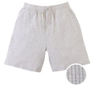 Gingersnaps Boys' Denzel Waffle Knit Drawstring Shorts feature a light gray melange color, textured waffle knit finish, elastic waistband, and side pockets. A circular inset shows off the unique pattern.