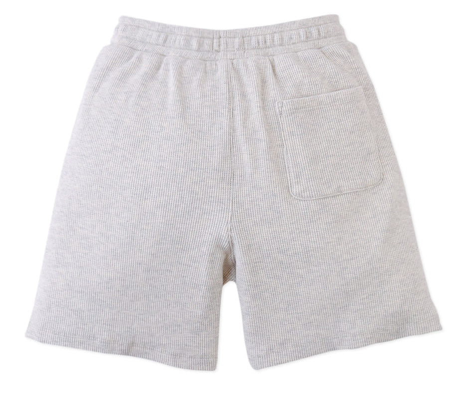 The Gingersnaps Boys' Denzel Waffle Knit Drawstring Shorts in light grey melange feature an elastic waistband, single back pocket, and soft waffle knit fabric, shown flat on a white background.