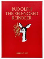 Graphic Image’s "Rudolph the Red Nosed Reindeer Leather Book" is a red hardcover edition featuring the classic Christmas story and the iconic reindeer with his glowing red nose.