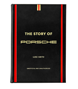 The Story Of Porsche Black Leather Book by Graphic Image exudes luxury with its black cover, accentuated by red and gold vertical stripes, capturing the essence of race car manufacturing.