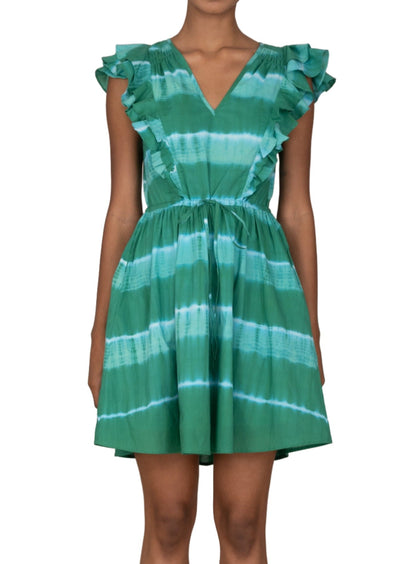 Person wearing the **Banjanan Felka Dress** by **Banjanan**, a green and blue tie-dye casual mini dress with ruffled shoulders, a gathered drawstring waist, and a V-neckline.