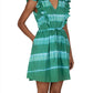 A person is wearing a green Banjanan Felka Dress by Banjanan.