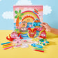 A hand holds up a brightly decorated Puffy Pages sea creature cutout by Bright Stripes in front of a beach-themed drawing, bringing playful ocean animals to life. Other Puffy Pages creations, markers, and crayons are spread out on a yellow table for endless on-the-go fun.
