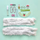 A flat-lay of DIY Chenille Cuties - Bunny Babes craft supplies from Bright Stripes on a light blue background, including glue, beads, doll glasses, a strawberry-print collar, and two lengths of white faux fur trim—perfect components for assembling your own DIY craft kit or making adorable bag danglers.