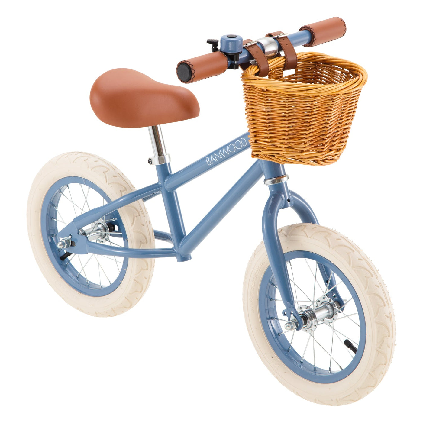 A blue Banwood Kids’ Vintage First Go Balance Bike, featuring white tires, a brown seat and handlebars, and a charming wicker basket on the front—ideal as a child’s first bike for young riders.