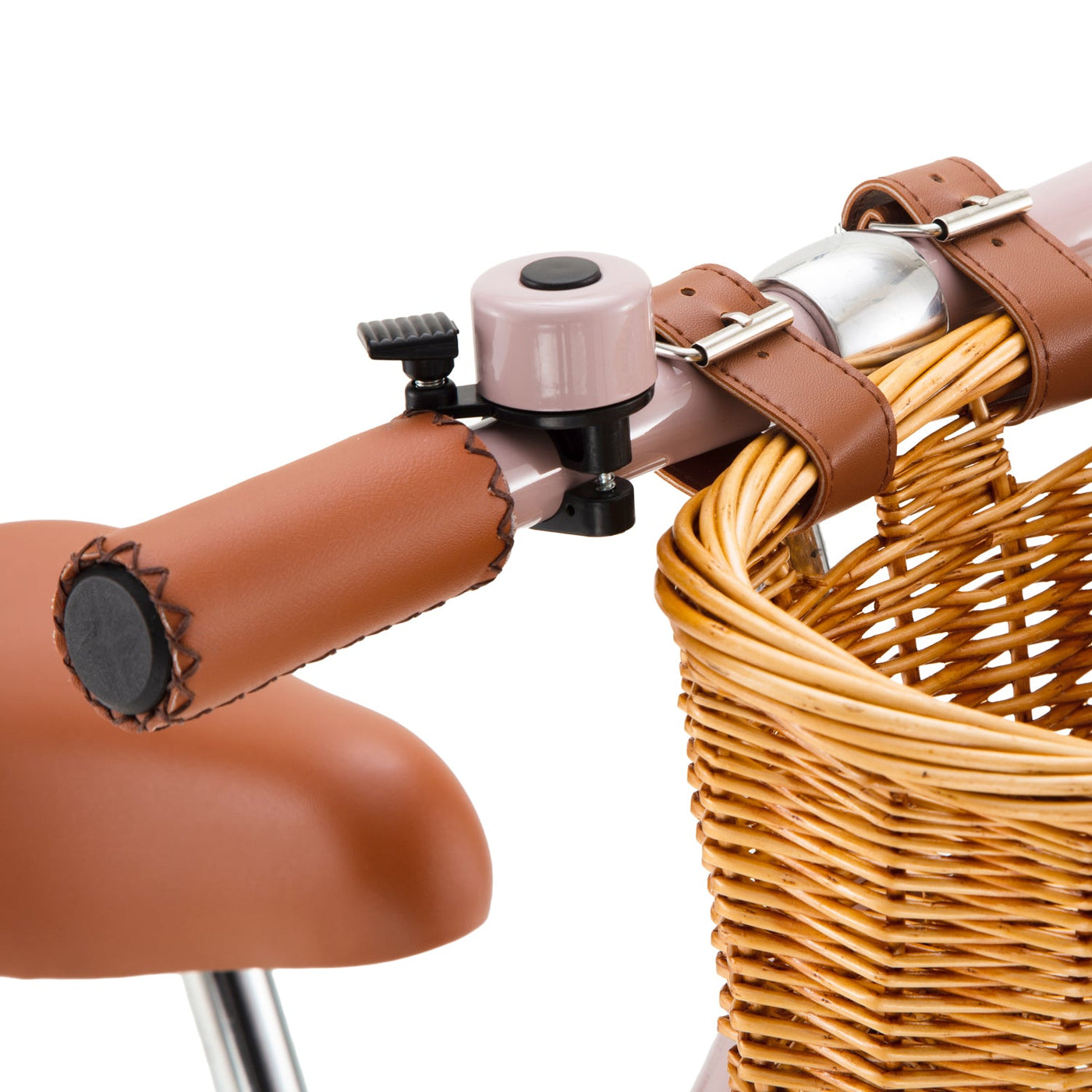 Close-up of the handlebar of the Banwood Kids’ Vintage First Go Balance Bike, featuring a brown leather grip, a small bell, and a wicker basket attached to the front.