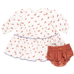 A baby girl's white long-sleeve Pink Chicken Julia Dress featuring a charming red horse pattern, paired with rust-colored bloomers adorned with chambray detailing.