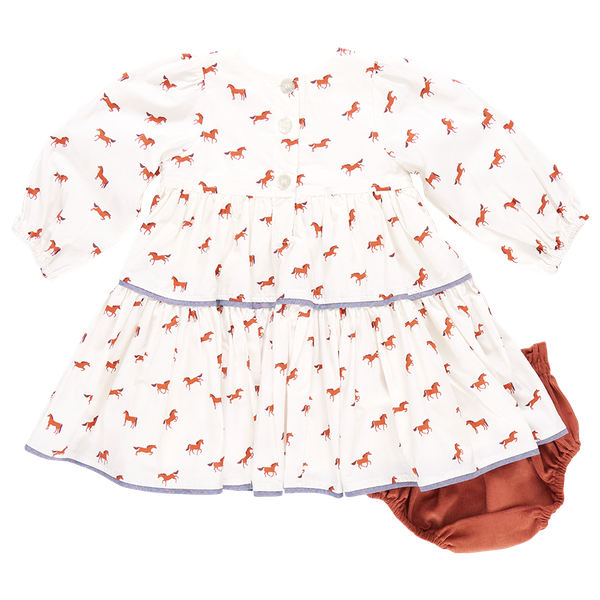 The Pink Chicken Baby Girls' Julia Dress is a delightful choice, featuring a white long-sleeved design adorned with red horse patterns and a tiered skirt. It comes paired with a matching corduroy diaper cover for added charm.