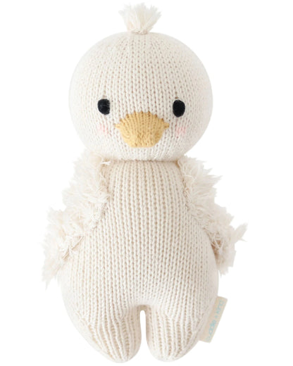 The Baby Gosling by Cuddle + Kind is a hand-knit, cream-colored plush made from soft Peruvian cotton yarn, featuring a yellow beak, black eyes, and textured wings—an adorable pick for any baby animals collection.