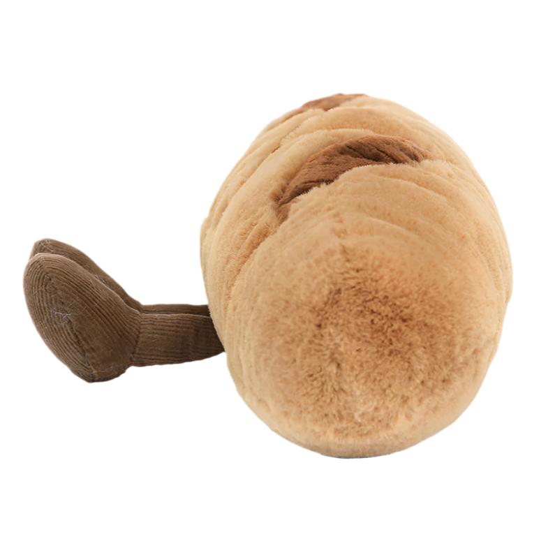 A plush toy from Jellycat called the Amuseables Baguette, designed to resemble a brown-tailed baguette and made from soft, huggable materials.