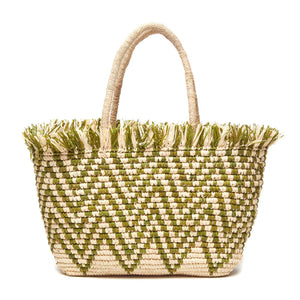 The Mar Y Sol Bahia Tote is woven from straw with green zigzag patterns, dual handles, and playful fringe at the top—an ideal summer accessory for stylish outings.