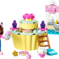 Introducing the LEGO® Bakey with Cakey Fun set from Legos - Toyhouse, featuring a girl with cat ears, a large cupcake, cat-faced accessories, and a small white cat figure. This creative construction building toy set also includes various baking-themed pieces for endless imaginative play.