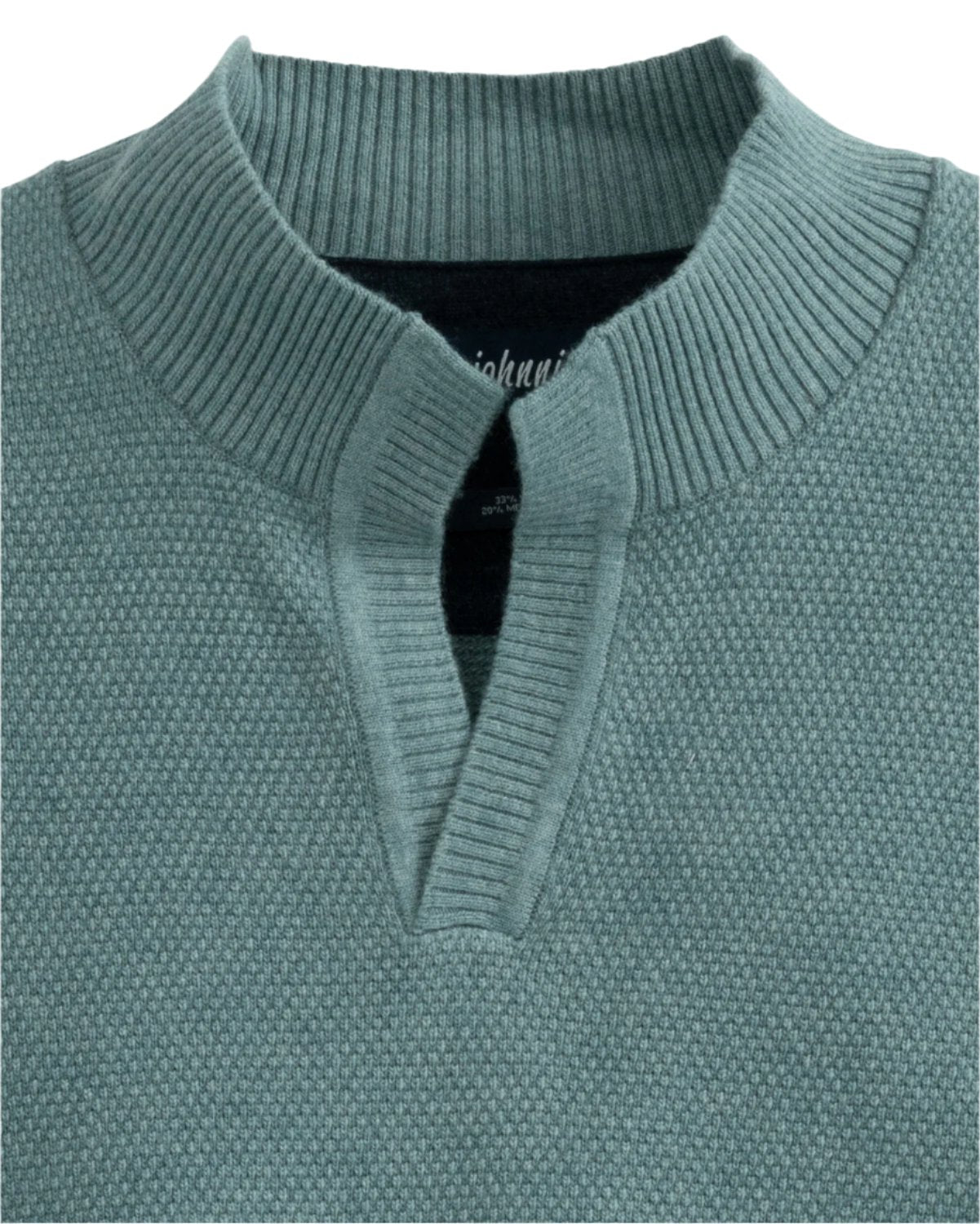 A Johnnie-O Estaban Quarter Slit Sweater in green, showcasing a Johnny collar and v-notch detail, evokes the effortless style of Steve McQueen.