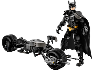 The LEGO® DC Batman™ Construction Figure from Legos - Toyhouse, featuring a black cape, is displayed alongside the meticulously crafted Bat-Pod Bike model.