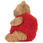 Jellycat Bartholomew Bear 'Heartthrob' sits in profile on a white background, wearing a red sweater and exuding cozy charm.