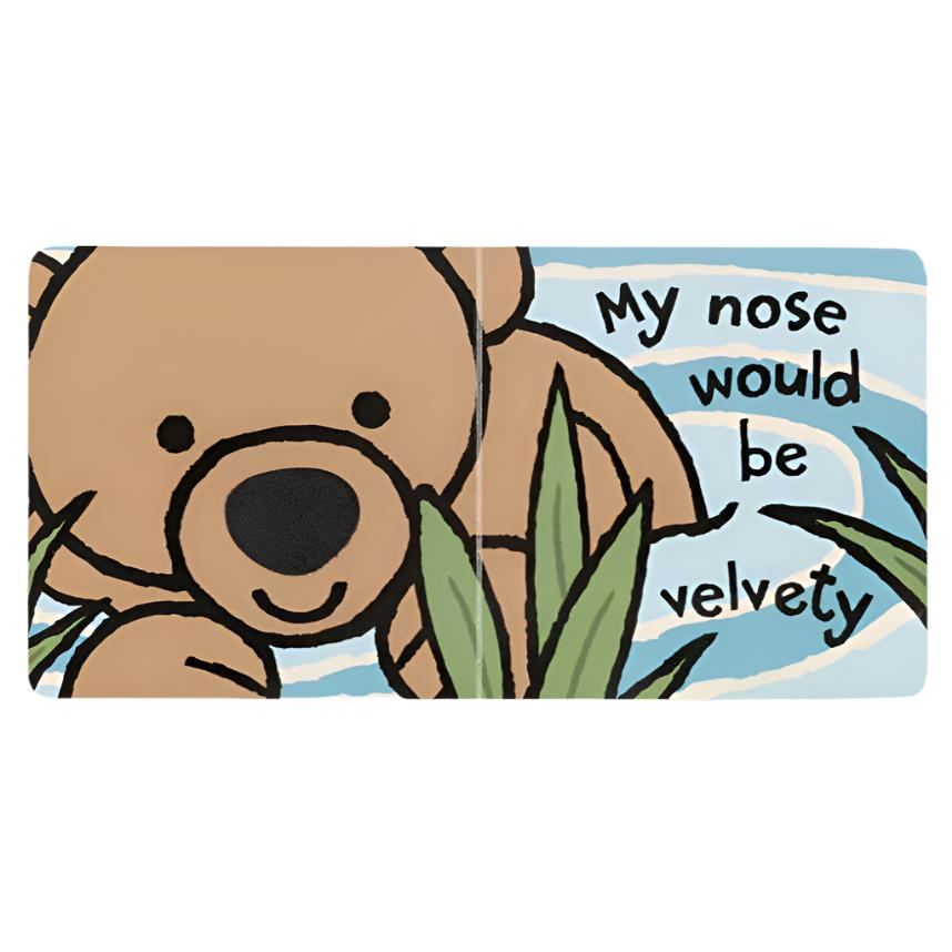 This illustration features a brown bear with a black nose on a blue background, capturing the delightful style of the Jellycat "If I Were A Bear" Board Book. The text reads, "If I Were A Bear, My nose would be velvety.