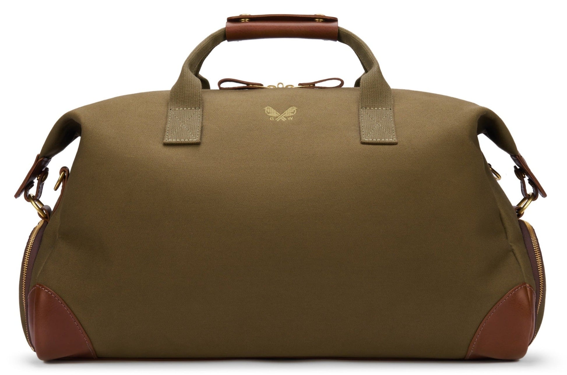 The Bennett Winch Canvas Weekender in khaki and brown boasts two sturdy handles and a small emblem on the front. It's crafted from full grain leather with waterproof canvas for enhanced durability.