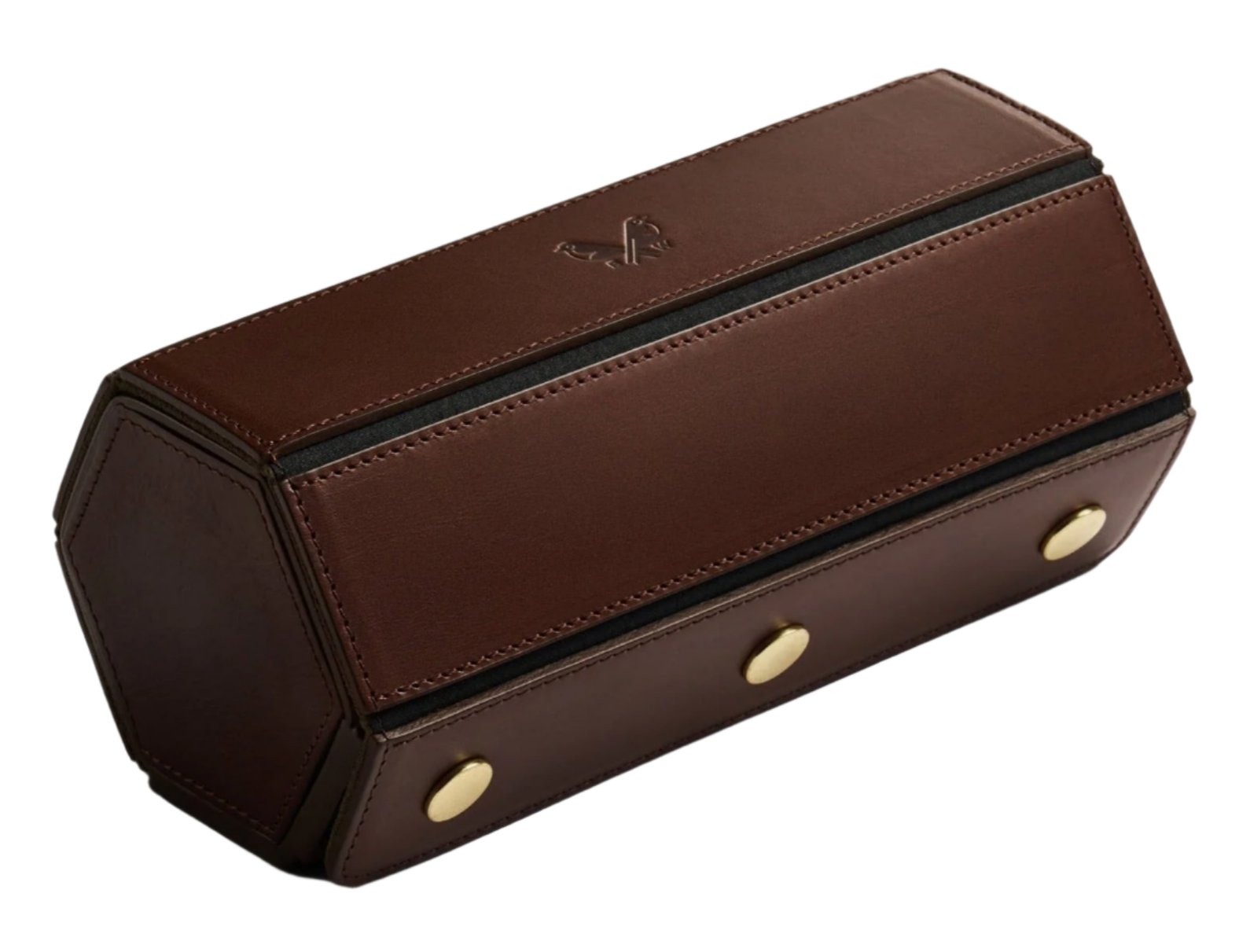 The Bennett Winch Triple Watch Roll, a brown, hexagonal leather case handcrafted in London with Tuscan leather panels, black zippers, and gold button details, is shown closed against a white background.