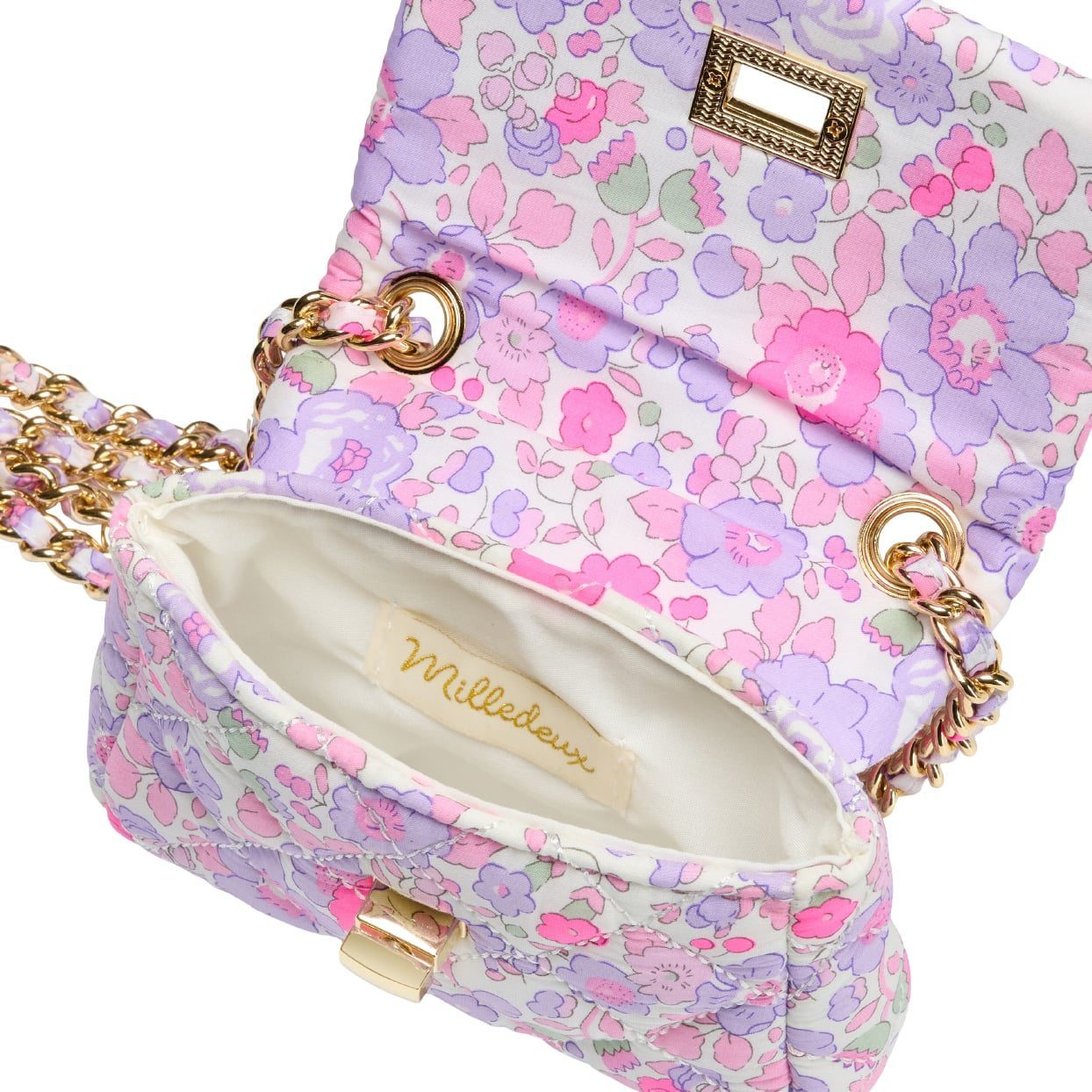 The Milledeux® Small Chain Bag – Liberty Fabric Betsy F / Neon is a petite handbag adorned with a floral pattern from Liberty of London fabric, featuring an elegant gold chain strap. Inside, you'll find a light interior and the distinctive label "Milledeux.