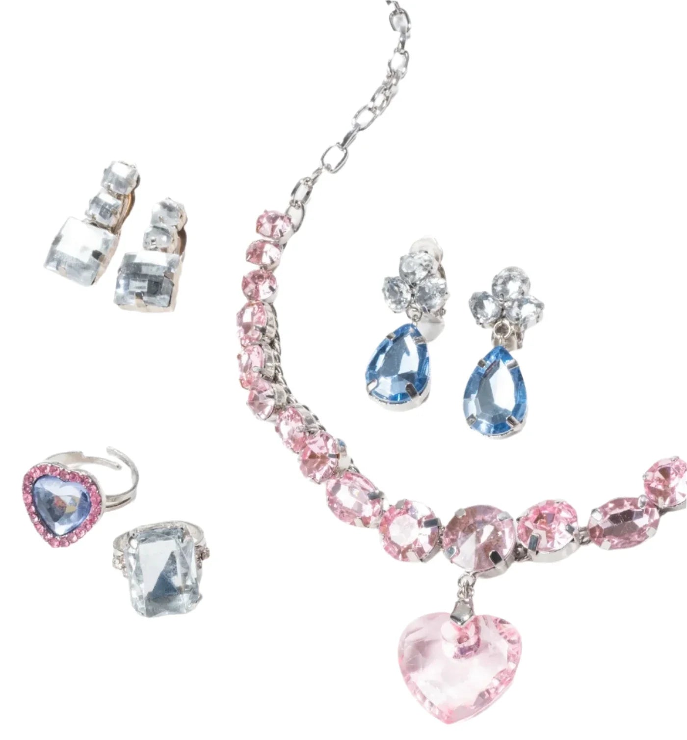 The Super Smalls Big Presentation Jewelry Set features pastel elegance with a pink gemstone necklace, blue gemstone earrings, and a pink-and-blue ring, all displayed beautifully on a white background.
