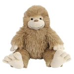 This brown plush toy, named MON AMI Boswell Big Foot by the Mon Ami brand, features a smiling mythical creature that resembles both a bear and a yeti. Sitting upright on a white background, it captures the perfect blend of woodland plush charm and the legend of Boswell Big Foot.