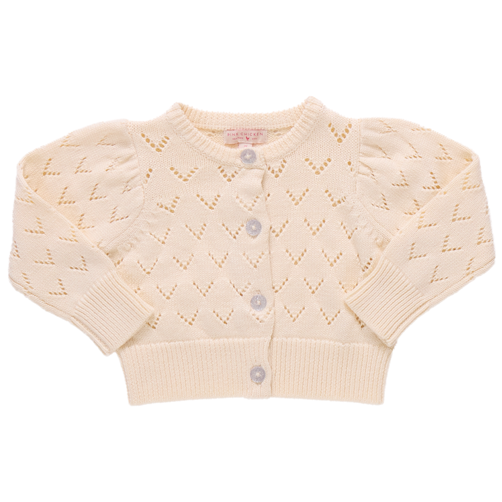 The Girls' Connie Sweater by Pink Chicken is a cream-colored, long-sleeve sweater with a heart-shaped pointelle pattern and glitter button front closure.
