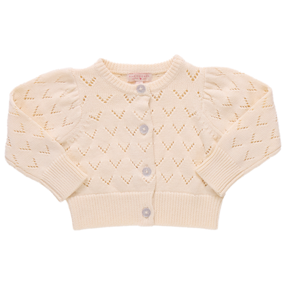 The Girls' Connie Sweater by Pink Chicken is a cream-colored, long-sleeve sweater with a heart-shaped pointelle pattern and glitter button front closure.