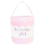 The Bits & Bows Birthday Girl Tote is a pink and white handled tote with colorful "birthday girl" lettering—perfect as a giftable bucket for toys or treats.