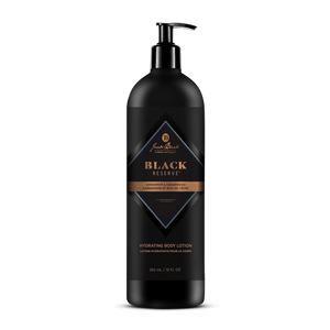 A black bottle of Jack Black Black Reserve Hydrating Body Lotion with a convenient pump dispenser, adorned with gold and blue label accents and text highlighting its cedarwood and cardamom scent. This masculine moisturizer is enriched with Shea Butter to provide deep hydration.