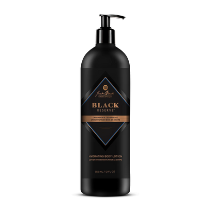 A black bottle of Jack Black Black Reserve Hydrating Body Lotion with a convenient pump dispenser, adorned with gold and blue label accents and text highlighting its cedarwood and cardamom scent. This masculine moisturizer is enriched with Shea Butter to provide deep hydration.