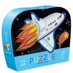 The Crocodile Creek "Blast Off 12 Piece Mini Puzzle" depicts a cartoon space shuttle with vibrant flames, flying through outer space amidst a starry backdrop.