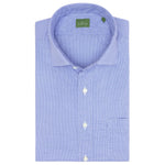 A folded Sid Mashburn Spread Collar Sport Shirt, featuring a light blue checkered pattern and crafted from Portuguese poplin, with a distinctive green label inside the collar. The shirt is accented by white buttons and includes a visible front pocket.