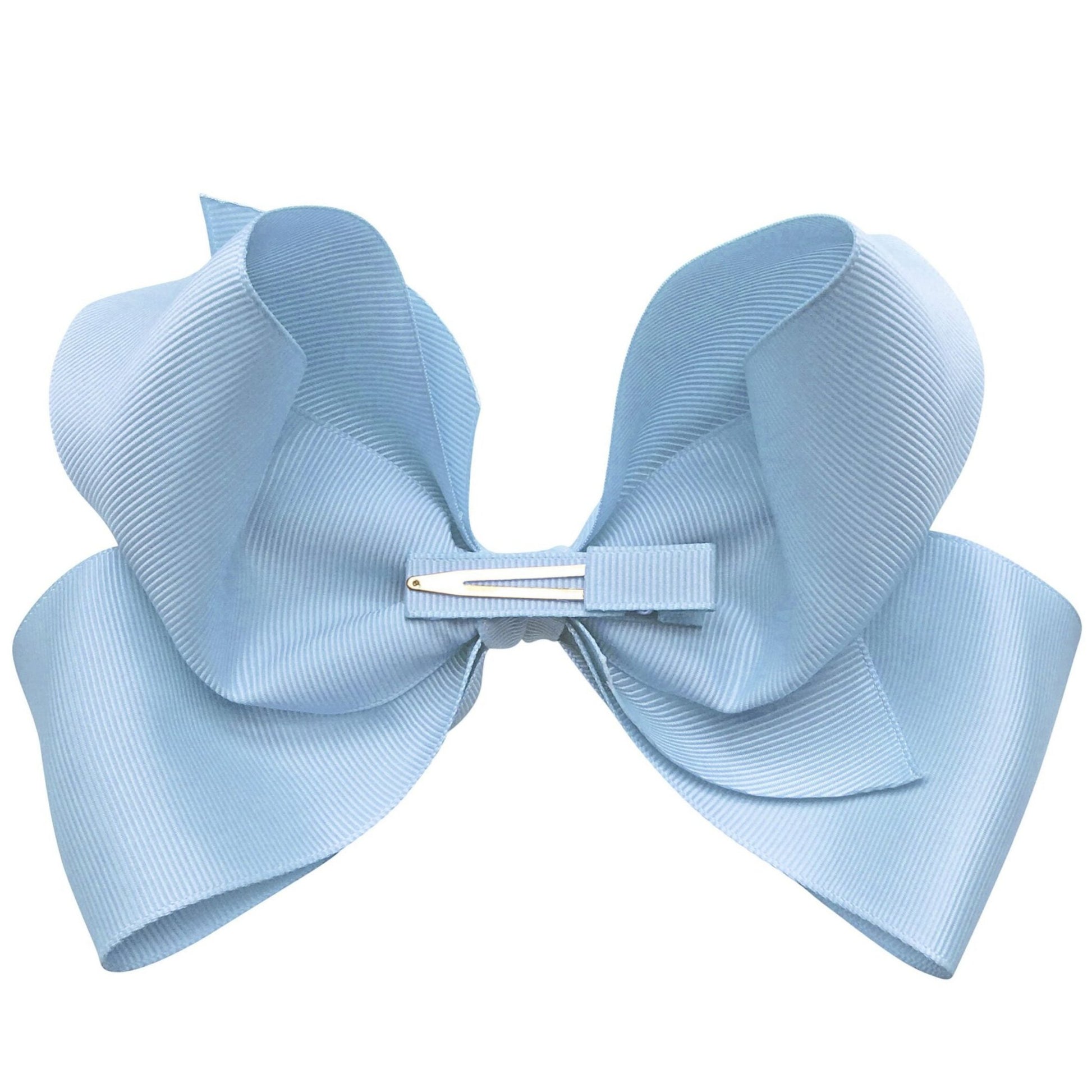 The Milledeux® Jumbo Boutique Bow in Bluebell, made from OEKO-TEX® materials, features a textured light blue ribbon and is attached to a grosgrain-covered alligator clip.