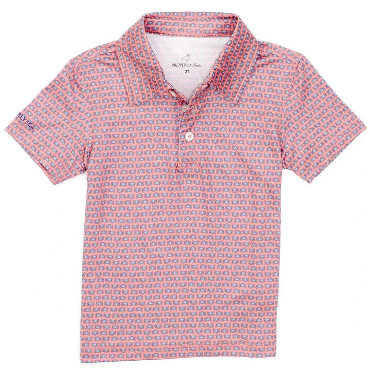The Boys' Inlet Polo by Properly Tied is a short-sleeve, red and blue checkered collared shirt with a button-up front, made from moisture-wicking fabric for comfort and performance.
