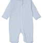 The Kissy Kissy Baby Crescent Moonlight Zip Footie is a light blue baby girl onesie featuring a front zipper and subtle moon and star prints, crafted from soft Pima cotton for ultimate comfort.